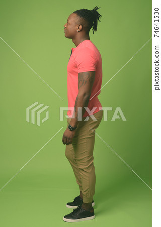 Young handsome African man from Kenya against green background 74641530