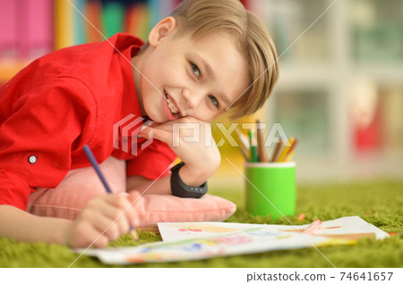 Close-up portrait of cute little boy drawing Close-up portrait of cute little boy drawing 74641657