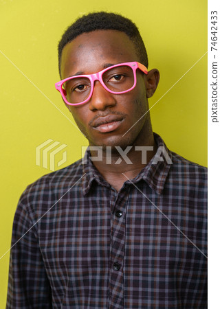 Face of young African hipster man with eyeglasses Face of young African hipster man with eyeglasses 74642433