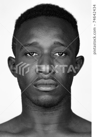Face of young African man in black and white 74642434