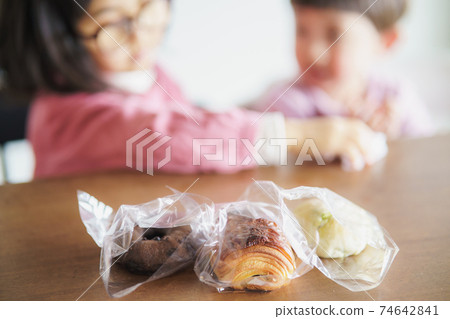 Child cheeking bread Child cheeking bread 74642841
