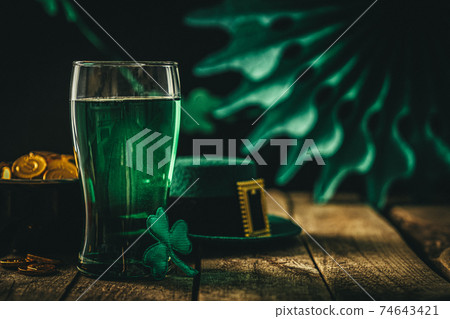 St. Patricks day concept - green beer and symbols St. Patricks day concept - green beer and symbols 74643421