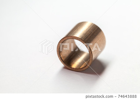 Sleeve bronze bearing lays on a white background 74643888