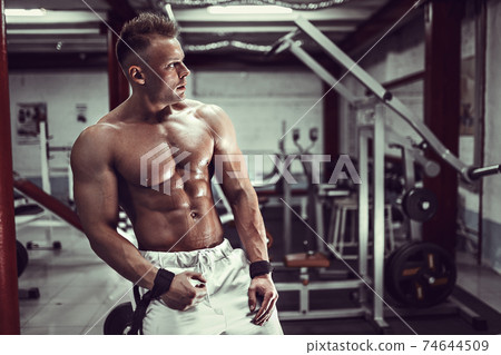Bodybuilder resting after workout 74644509