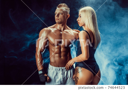 Attractive couple, a slim blonde female and handsome shirtless g Attractive couple, a slim blonde female and handsome shirtless g 74644523