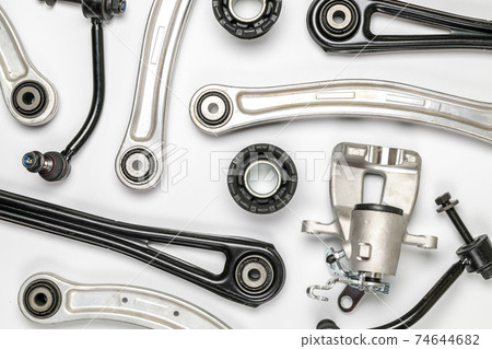 White car part. Set of new metal car part. Auto motor mechanic spare or automotive piece isolated on white background. Technology of mechanical gear with space for text. White car part. Set of new metal car part. Auto motor mechanic spare or automotive piece isolated on white background. Technology of mechanical gear with space for text. 74644682