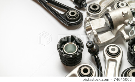 Engine gears. Auto motor mechanic spare or automotive piece on white background. Set of new metal car part. Technology of mechanical gear. Engine gears. Auto motor mechanic spare or automotive piece on white background. Set of new metal car part. Technology of mechanical gear. 74645003