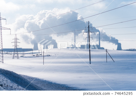 Thermal power plant pipes in winter. Industrial landscape. Thermal power plant pipes in winter. Industrial landscape. 74645295