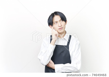 Male restaurant clerk think 74649468