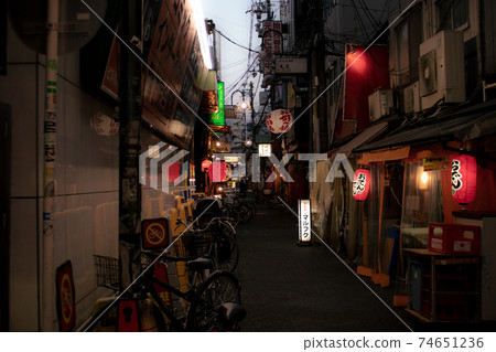 Narrow alley at dusk Narrow alley at dusk 74651236