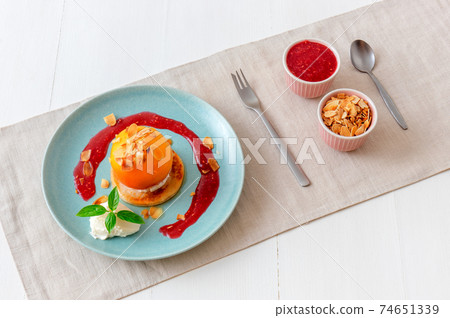 Roasted Peaches, tasty fresh fruit dessert with lemon, lime and basil creme fraiche and raspberry coulis. Roasted Peaches, tasty fresh fruit dessert with lemon, lime and basil creme fraiche and raspberry coulis. 74651339