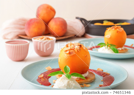 Roasted Peaches, tasty fresh fruit dessert with lemon, lime and basil creme fraiche and raspberry coulis. Roasted Peaches, tasty fresh fruit dessert with lemon, lime and basil creme fraiche and raspberry coulis. 74651346