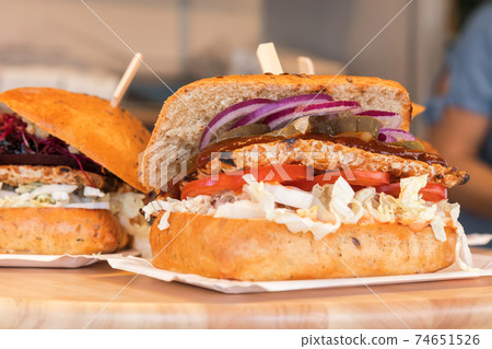 The variations of grilled tempeh, Indonesian vegetarian food. Barbecue style with salad, tomato and red onion. The variations of grilled tempeh, Indonesian vegetarian food. Barbecue style with salad, tomato and red onion. 74651526