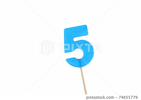 lolipop in number 5 shape. sweet candy on wooden stick.  74655779