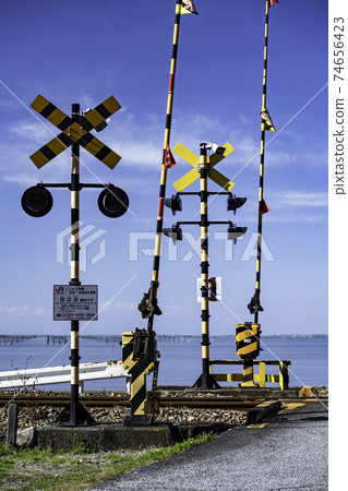 White clouds in the clear blue sky A crossing of the triangular line where you can see the blue sea of the Ariake Sea White clouds in the clear blue sky A crossing of the triangular line where you can see the blue sea of the Ariake Sea 74656423