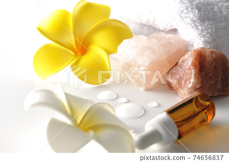 Image shooting of spas and beauty treatment salons using rock salt, aroma oil, white towels, and plumeria flowers (white background) Image shooting of spas and beauty treatment salons using rock salt, aroma oil, white towels, and plumeria flowers (white background) 74656837