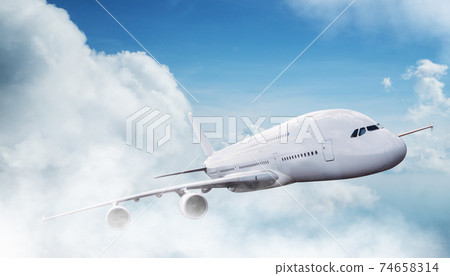 Huge two-storey passengers commercial airplane flying above dramatic clouds. 74658314