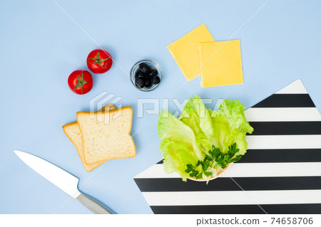 Fun food art for kids. Ladybug sandwich on blue background. How to make creative breakfast for kid at home. Step by step instruction, view from above. Step 1. Food Set. Fun food art for kids. Ladybug sandwich on blue background. How to make creative breakfast for kid at home. Step by step instruction, view from above. Step 1. Food Set. 74658706