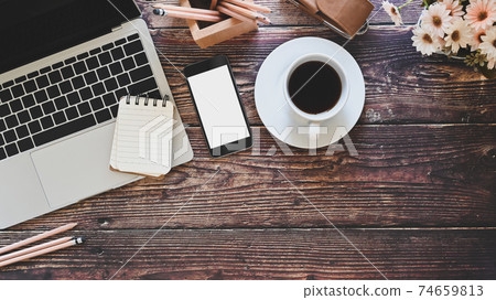 Office desk laptop, mockup smartphone and office supplies with coffee, Top view workspace old wood table. Office desk laptop, mockup smartphone and office supplies with coffee, Top view workspace old wood table. 74659813