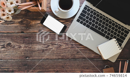 Office desk laptop, mockup smartphone and office supplies with coffee, Top view workspace old wood table. Office desk laptop, mockup smartphone and office supplies with coffee, Top view workspace old wood table. 74659814