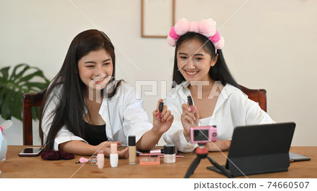 Beauty blogger concept, woman review gift product recording video make up lipstick cosmetic at home. Beauty blogger concept, woman review gift product recording video make up lipstick cosmetic at home. 74660507