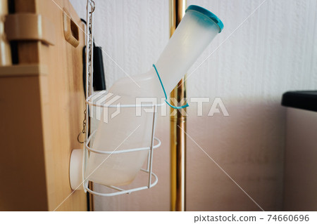 a urine plastic bottle in a hospital room 74660696