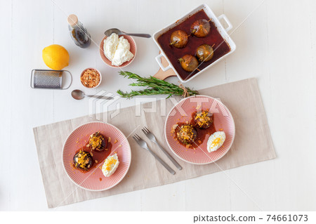 Caramelised figs with balsamic vinegar, rosemary, almonds and cottage cheese. Slow roasted homemade fruit dessert. White wooden table background. No people. Gordon Ramsey recipe. Caramelised figs with balsamic vinegar, rosemary, almonds and cottage cheese. Slow roasted homemade fruit dessert. White wooden table background. No people. Gordon Ramsey recipe. 74661073