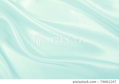 Smooth elegant blue silk or satin luxury cloth texture as abstract background. Luxurious background design 74661247