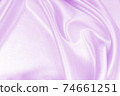 Smooth elegant lilac silk or satin texture as wedding background. Luxurious background design 74661251