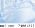 Smooth elegant blue silk or satin luxury cloth texture as abstract background. Luxurious background design 74661255