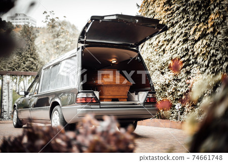 photo of a casket in a van at a funeral 74661748