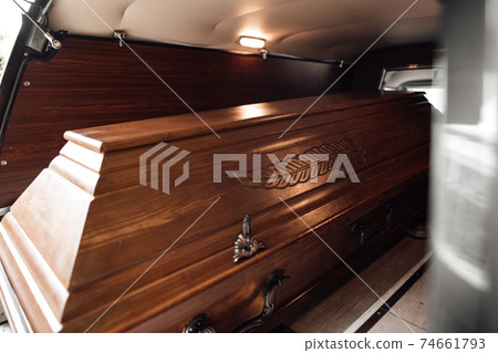 photo of a casket in a van at a funeral 74661793