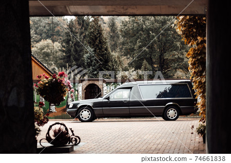 photo of a black van at a memorial service photo of a black van at a memorial service 74661838