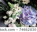 Gorgeous bouquet of roses and carnations with decorative dried flowers. 74662830