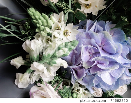 Gorgeous bouquet of roses and carnations with decorative dried flowers. 74662830