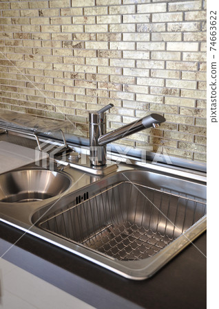 Interior of modern kitchen and stainless steel sink, tap and drain Interior of modern kitchen and stainless steel sink, tap and drain 74663622