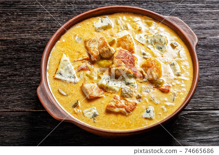 Pork stew with pickles, and blue mold cheese Pork stew with pickles, and blue mold cheese 74665686