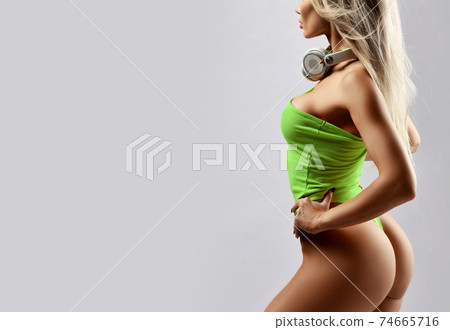 Portrait of sexy slim woman in yellow swimsuit and 74665716