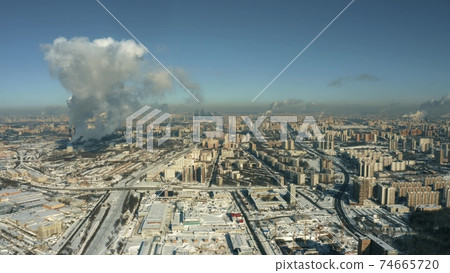 Aerial shot of Moscow on a cold sunny winter day, Russia. View from Ochakovo and Michurinsky avenue towards city centre 74665720