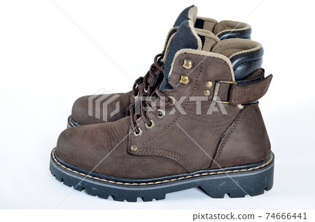 Hiking shoes and a white background, Sturdy hiking boots Hiking shoes and a white background, Sturdy hiking boots 74666441