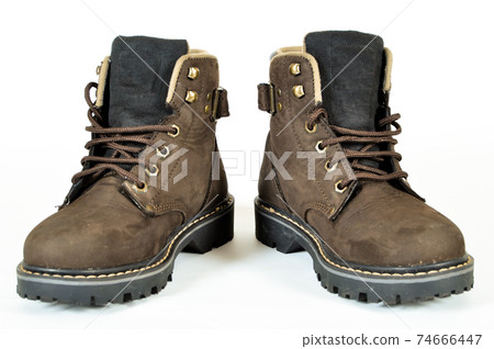 Hiking shoes and a white background, Sturdy hiking boots Hiking shoes and a white background, Sturdy hiking boots 74666447