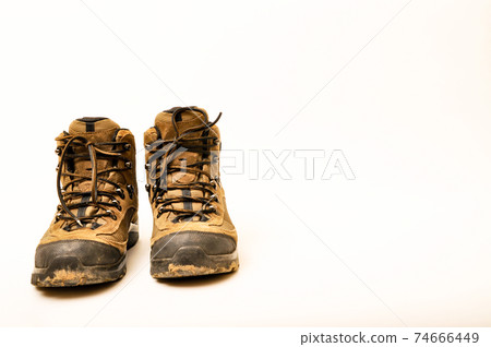 Hiking shoes and a white background, Sturdy hiking boots Hiking shoes and a white background, Sturdy hiking boots 74666449
