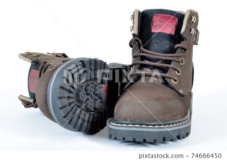 Hiking shoes and a white background, Sturdy hiking boots Hiking shoes and a white background, Sturdy hiking boots 74666450