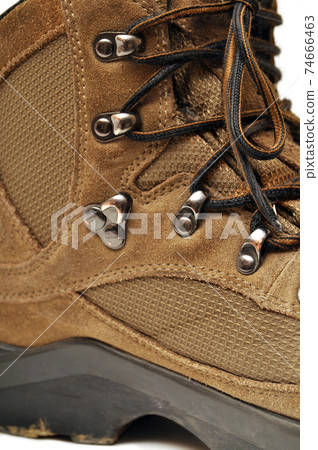 Hiking shoes and a white background, Sturdy hiking boots Hiking shoes and a white background, Sturdy hiking boots 74666463