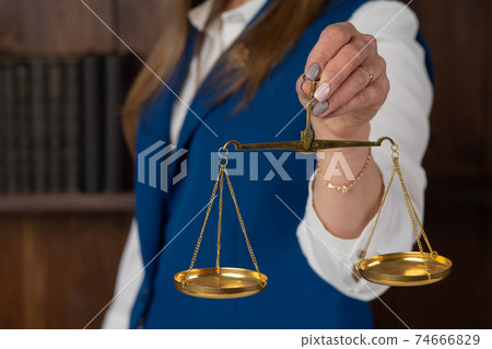 woman holding the justice scale woman holding the justice scale 74666829