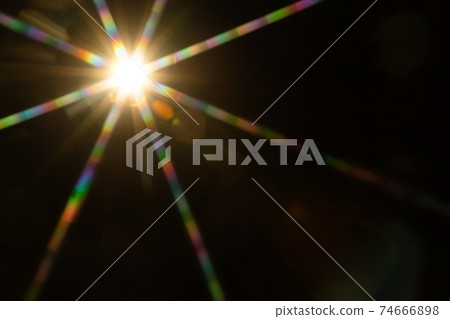 Abstract sun flare. The lens flare is subject to digital correction Abstract sun flare. The lens flare is subject to digital correction 74666898