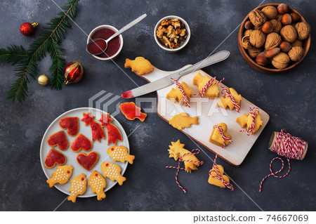 Baking with love for Merry Christmas. Baking Christmas cookies. Dark background table. 74667069