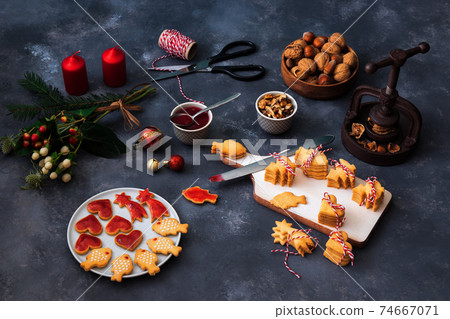 Baking with love for Merry Christmas. Baking Christmas cookies. Dark background table. Baking with love for Merry Christmas. Baking Christmas cookies. Dark background table. 74667071