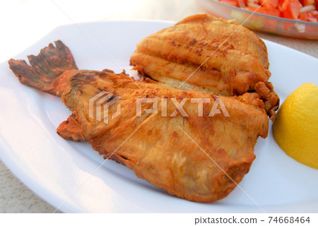 Delicious and beautiful fried trout fish, in a plate 74668464