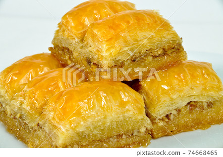 Baklava with walnut, one of the most beautiful desserts of Turkish cuisine Baklava with walnut, one of the most beautiful desserts of Turkish cuisine 74668465